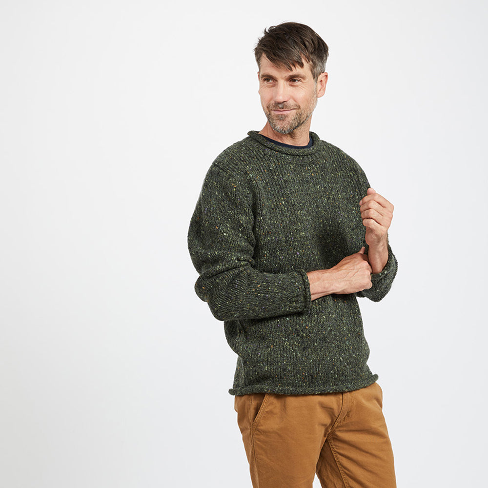 Man in green Donegal Tweed roll neck sweater