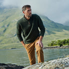 Man in green Troyer zip sweater
