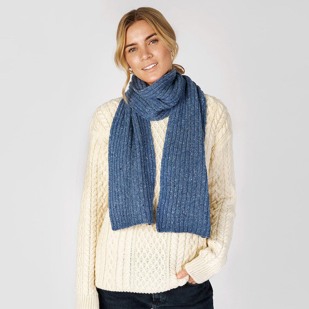 Woman wearing square blue ocean scarf