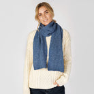 Woman wearing square blue ocean scarf