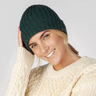 Woman wearing square evergreen hat