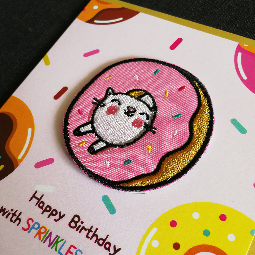 Square sprinkles cat donut patch on birthday card
