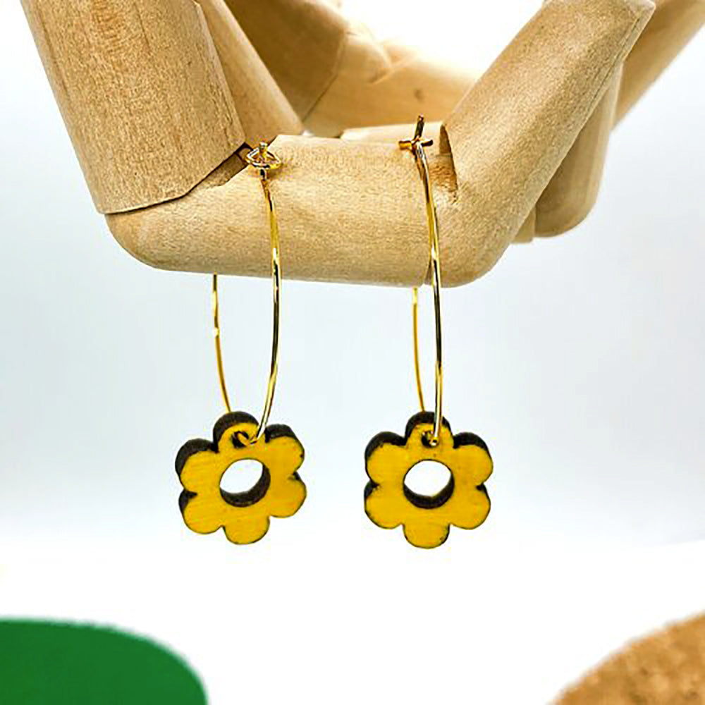 Wooden daisy earrings on display