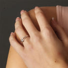 Triity ring on a woman's finger