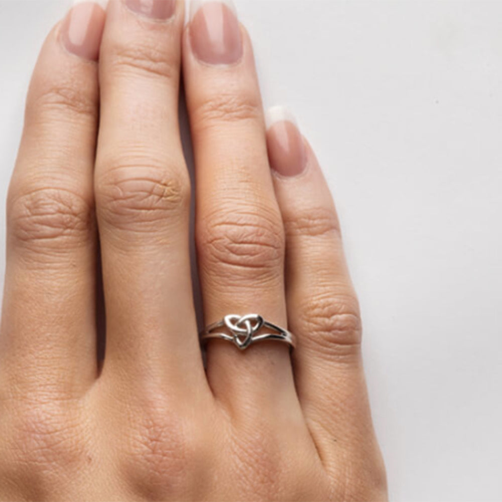 Woman's hand with trinity knot ring