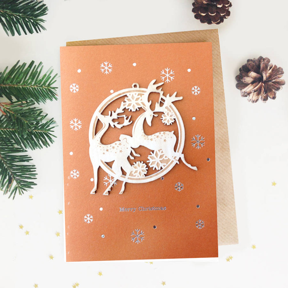 Wooden reindeer ornament on Christmas card
