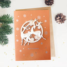 Wooden reindeer ornament on Christmas card